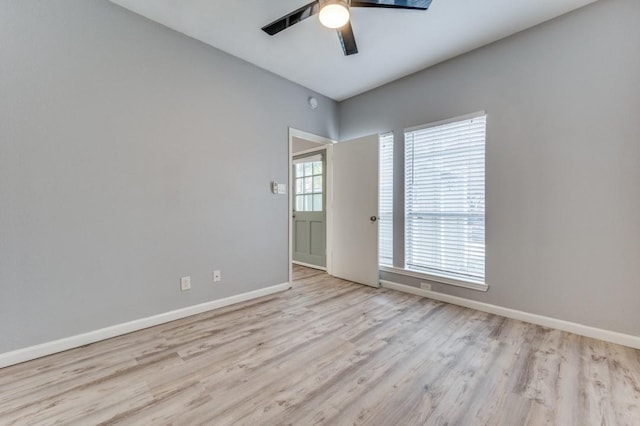 unfurnished room featuring light hardwood / wood-style floors and ceiling fan