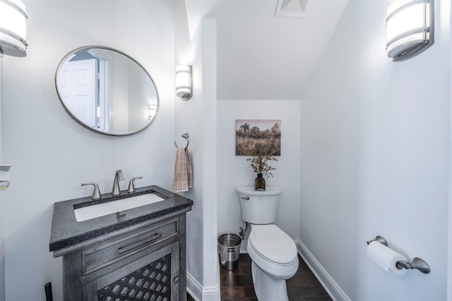 720 Amistad Dr, Prosper, TX 75078 - bathroom with toilet, wood finished floors, vanity, and baseboards