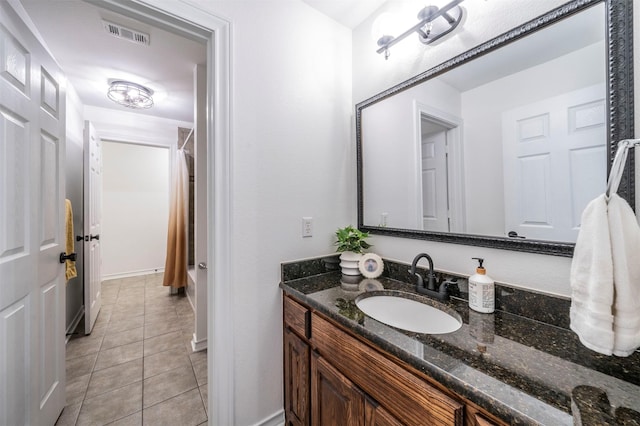 720 Amistad Dr, Prosper, TX 75078 - bathroom with vanity, tile patterned flooring, a shower with curtain, and baseboards