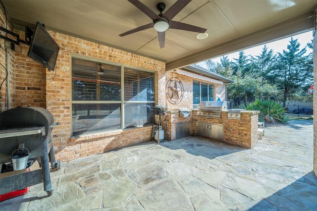 720 Amistad Dr, Prosper, TX 75078 - view of patio / terrace featuring exterior kitchen, area for grilling, ceiling fan, and fence