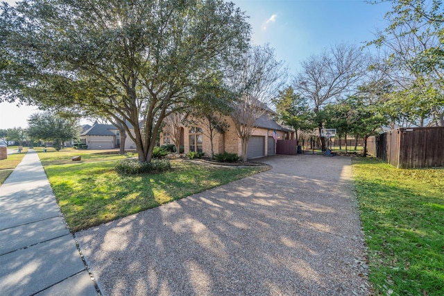 720 Amistad Dr, Prosper, TX 75078 - obstructed view of property featuring a garage and driveway