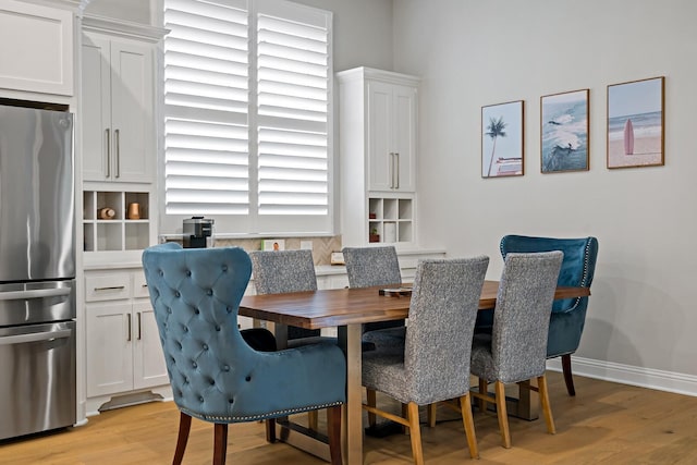 dining area featuring light wood-type flooring