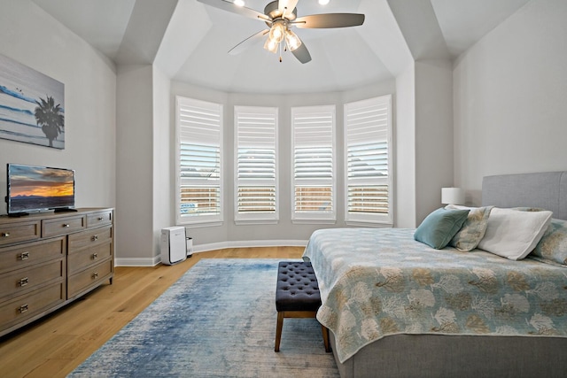 bedroom with ceiling fan and light hardwood / wood-style floors