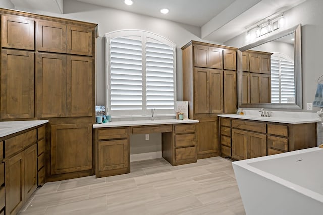 bathroom featuring a bathing tub and vanity