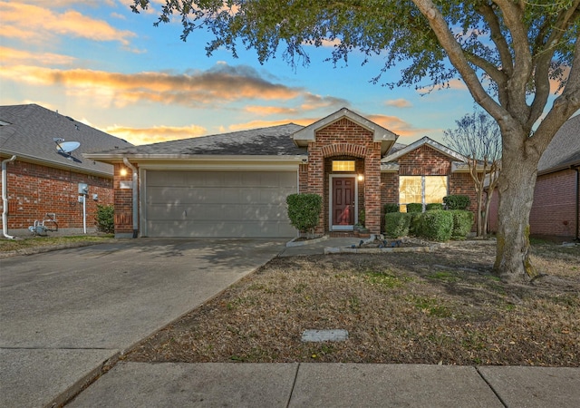 ranch-style house featuring a garage