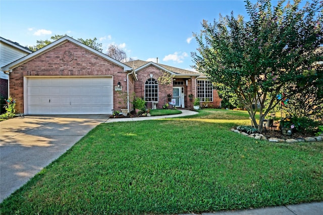 view of front of house with a garage and a front yard