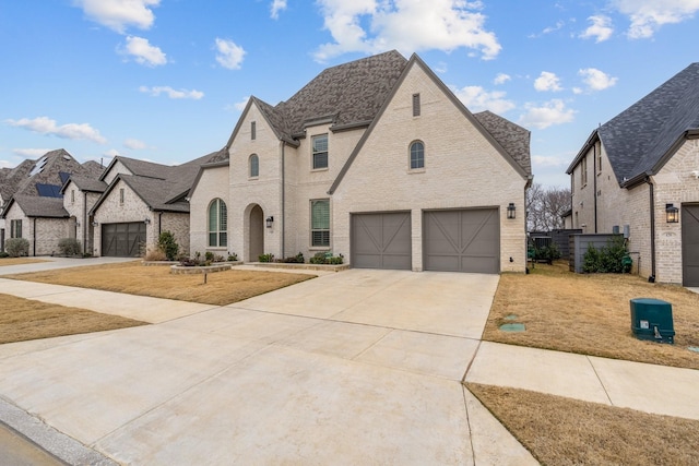 view of front of home featuring a garage and a front yard