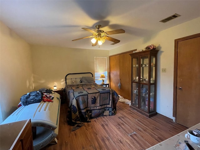 bedroom featuring ceiling fan and wood-type flooring