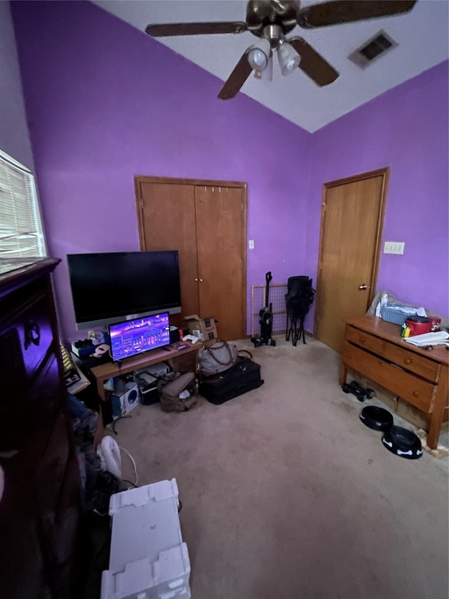 interior space with lofted ceiling and ceiling fan