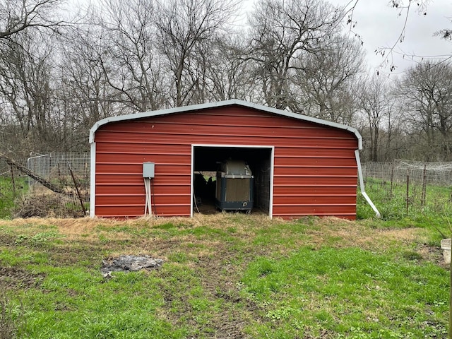 view of outbuilding featuring a yard