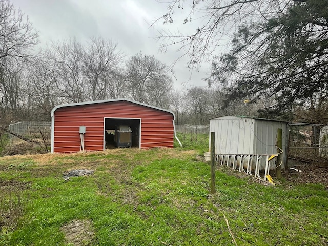 view of outbuilding featuring a yard