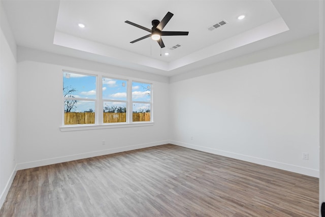 5065 Willie St, Fort Worth, TX 76105 - spare room featuring a raised ceiling, wood finished floors, baseboards, recessed lighting, and a ceiling fan