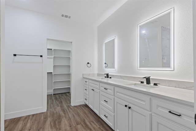 5065 Willie St, Fort Worth, TX 76105 - full bath featuring double vanity and wood finished floors