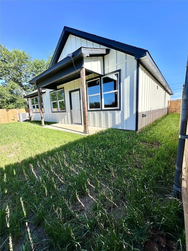 5065 Willie St, Fort Worth, TX 76105 - rear view of house with board and batten siding