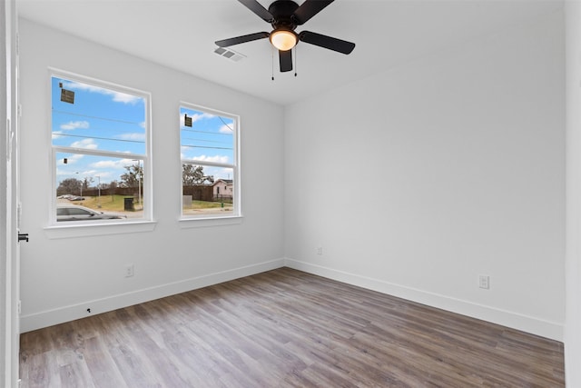 5065 Willie St, Fort Worth, TX 76105 - spare room with wood finished floors, baseboards, and a ceiling fan