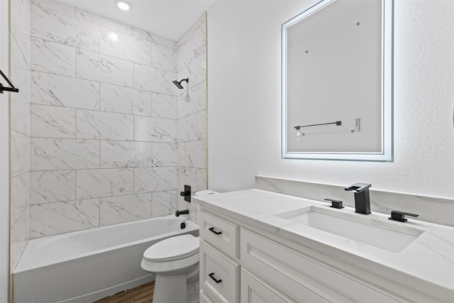 5065 Willie St, Fort Worth, TX 76105 - bathroom featuring toilet, shower / tub combination, vanity, and wood finished floors