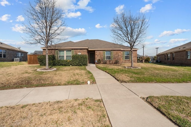 ranch-style home with central AC and a front lawn