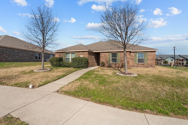 ranch-style home with a front lawn