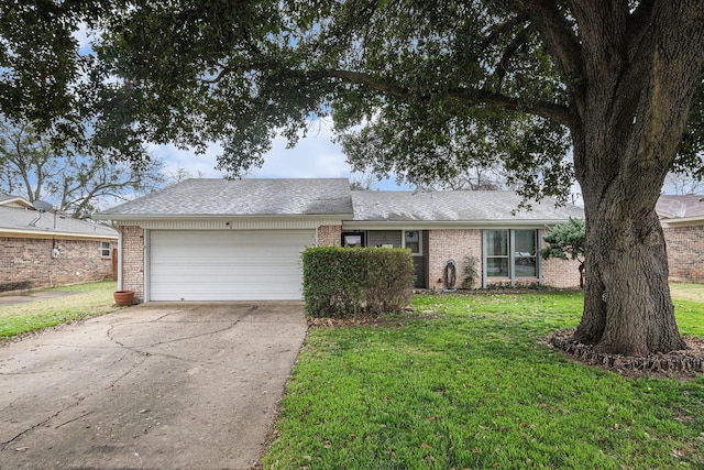 single story home featuring a garage and a front lawn