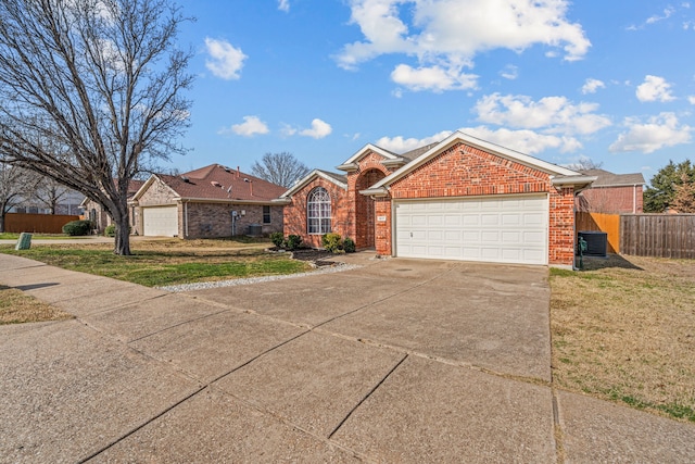 single story home featuring a garage and a front lawn