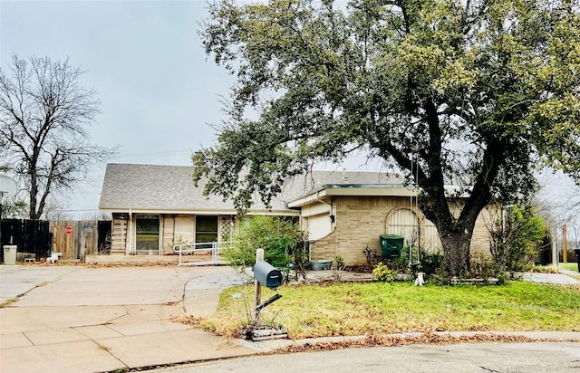 ranch-style house with a front lawn