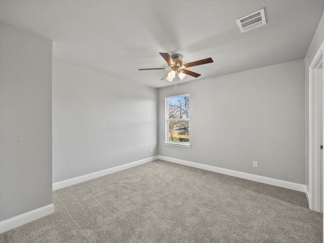 spare room with carpet floors and ceiling fan