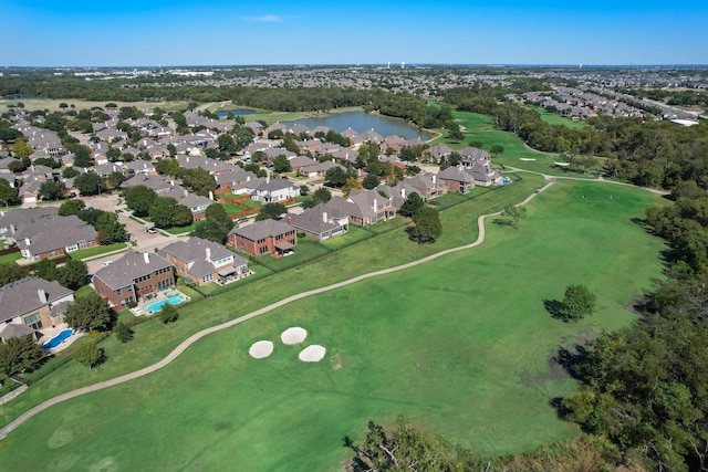 aerial view with a residential view, a water view, and golf course view