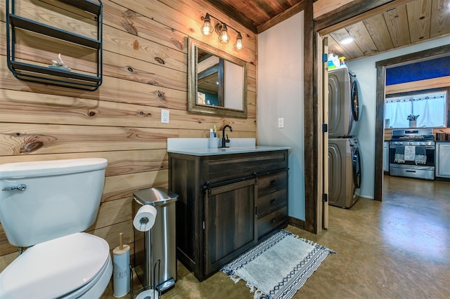 bathroom featuring wooden walls, stacked washer / dryer, wooden ceiling, concrete floors, and toilet