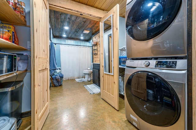 washroom featuring wood ceiling and stacked washer / dryer