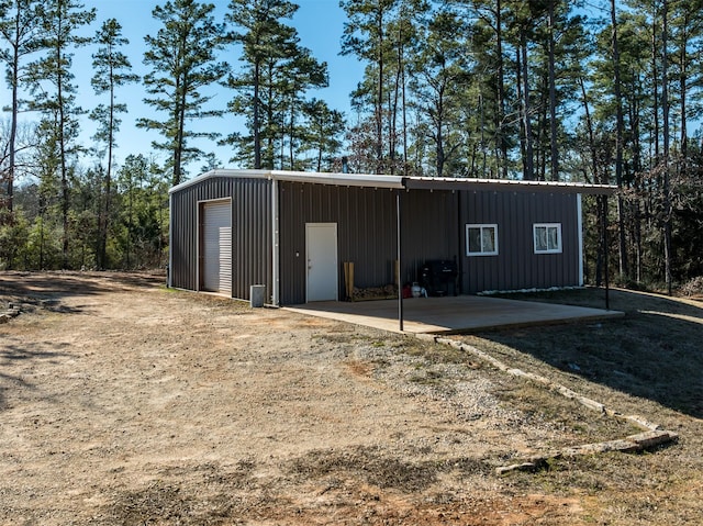 view of outbuilding featuring a garage