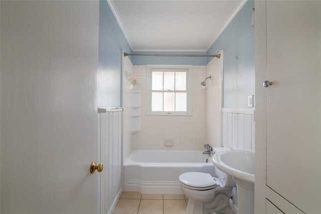 bathroom with tile patterned floors, tiled shower / bath combo, ornamental molding, and toilet