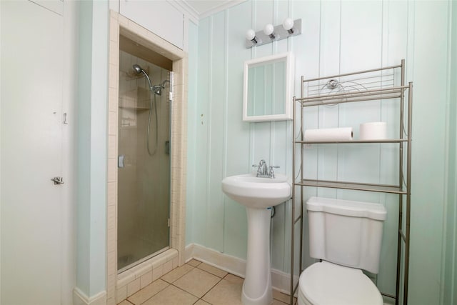 bathroom with walk in shower, tile patterned floors, and toilet