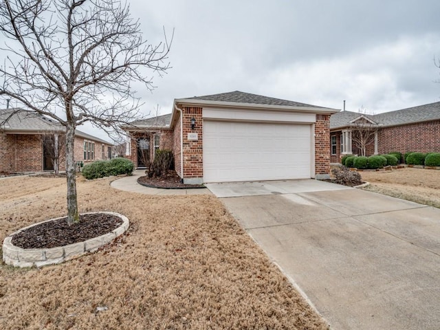 ranch-style house featuring an attached garage, a shingled roof, concrete driveway, and brick siding