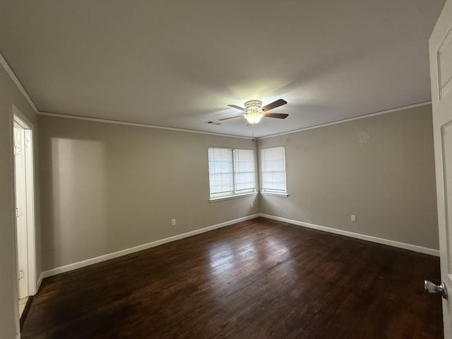 empty room with ornamental molding, dark hardwood / wood-style floors, and ceiling fan