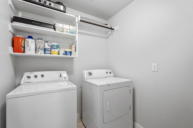 washroom featuring washing machine and dryer