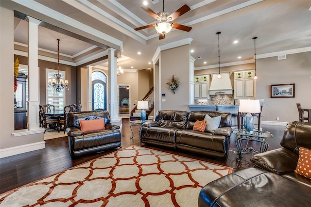 living room with crown molding, a tray ceiling, ceiling fan with notable chandelier, and light hardwood / wood-style floors