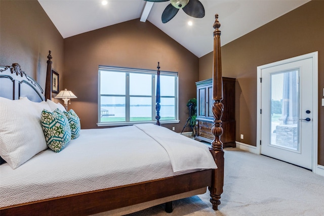 carpeted bedroom with vaulted ceiling with beams