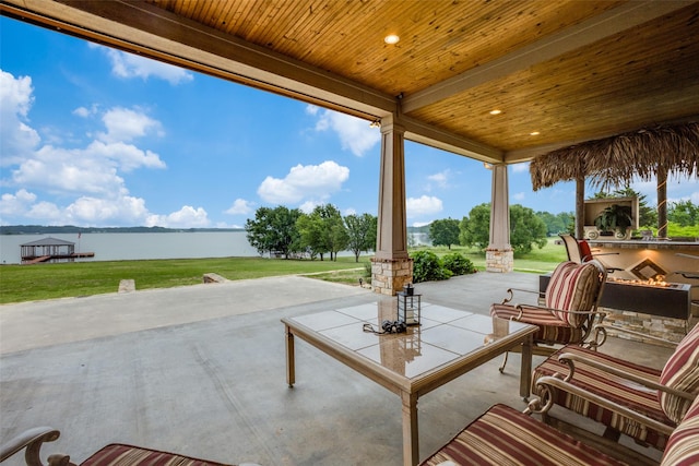 view of patio with a water view