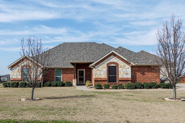 ranch-style home with a front lawn