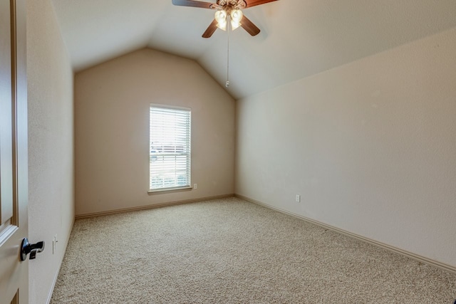 additional living space featuring lofted ceiling, carpet floors, and ceiling fan