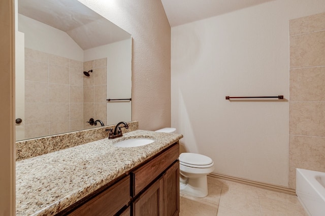 full bathroom featuring tiled shower / bath combo, vanity, vaulted ceiling, and toilet