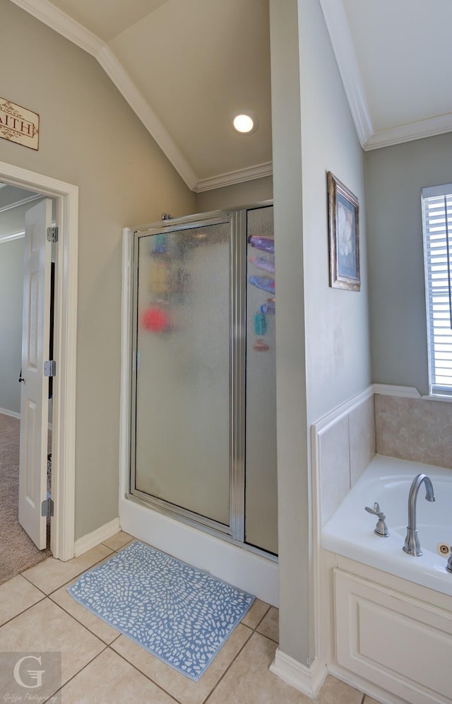 bathroom with ornamental molding, tile patterned floors, independent shower and bath, and lofted ceiling