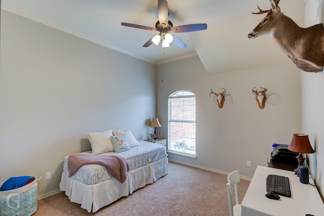 carpeted bedroom featuring crown molding and ceiling fan