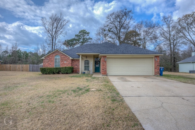 ranch-style home with a garage and a front lawn