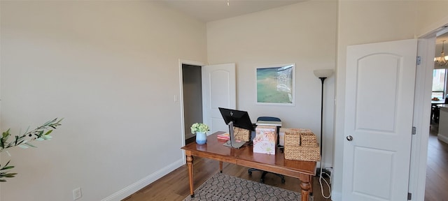 home office with wood-type flooring