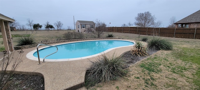 view of swimming pool with a storage unit