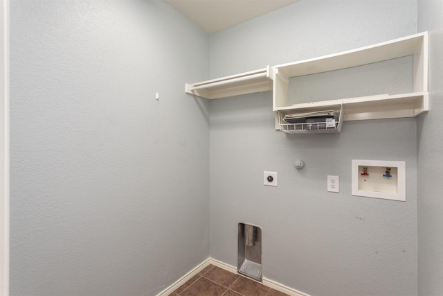 laundry room featuring electric dryer hookup, hookup for a washing machine, dark tile patterned floors, and gas dryer hookup