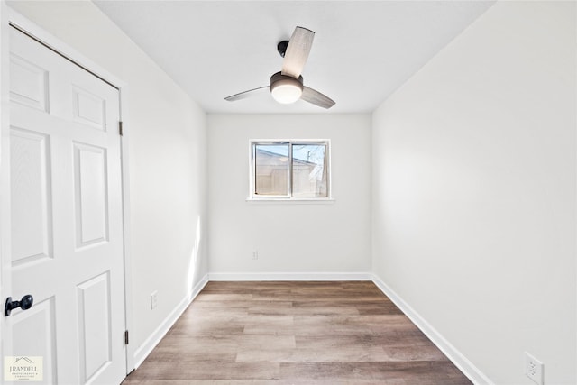 empty room featuring ceiling fan and light hardwood / wood-style floors