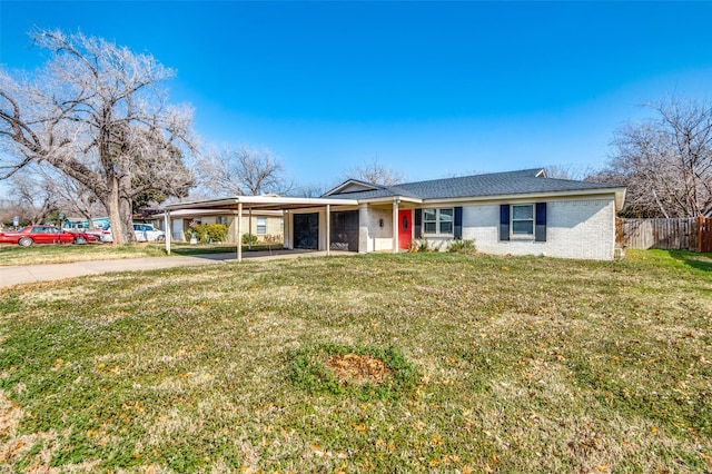 ranch-style home with a carport and a front yard