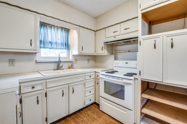 kitchen featuring white cabinetry, sink, and white range with electric stovetop